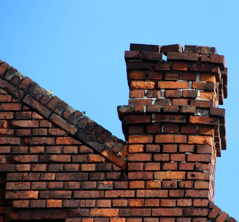 Signs Your Forest Hill Home Needs a Chimney Inspection Damaged chimney on an Forest Hill home showing cracks and missing mortar